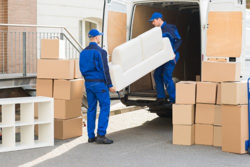 Removal team sorting recyclable items for a sustainable move in Knightsbridge