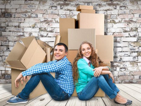 Packed van and team preparing items safely for transport