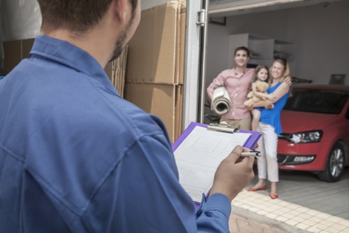Staff assessing lifting risks before moving furniture