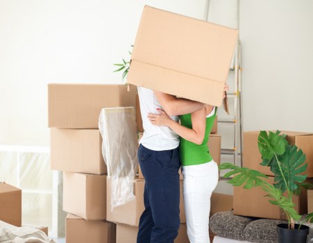 Professional movers loading boxes into a removal van in Knightsbridge
